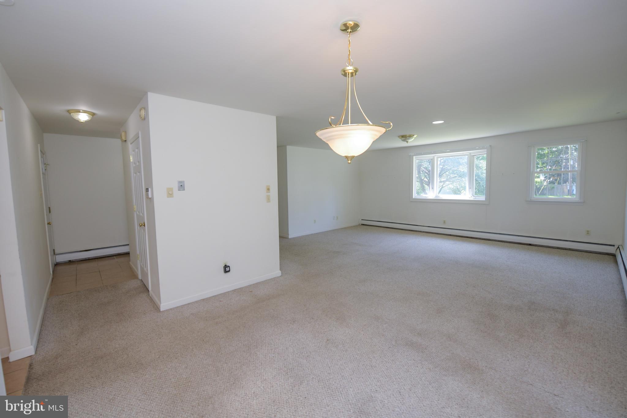 2 Broadale Road Doylestown, PA 18901 - Photo 30 of 56 a view of an empty room with window and chandelier fan