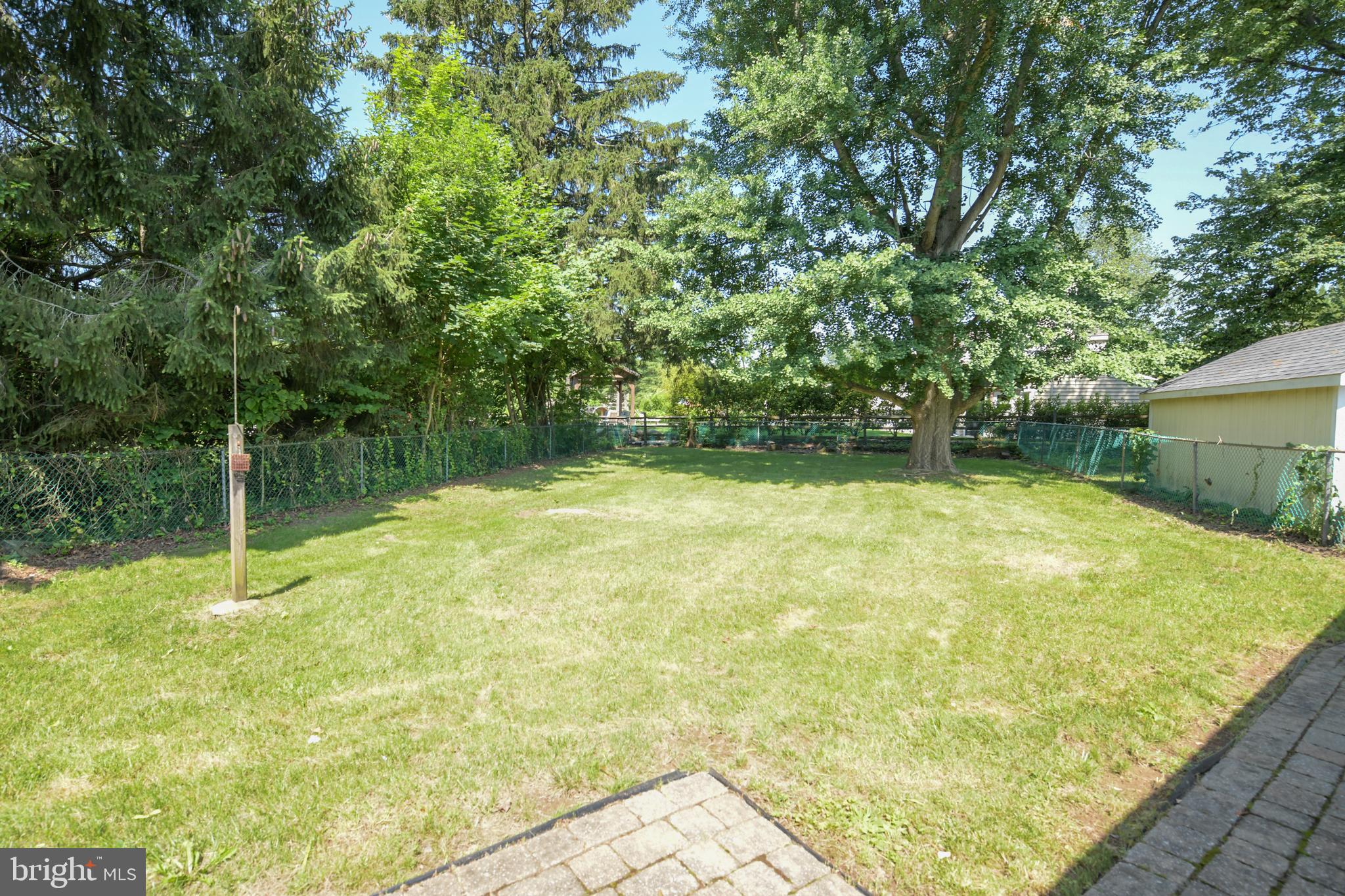 2 Broadale Road Doylestown, PA 18901 - Photo 8 of 56 a backyard of a house with lots of green space
