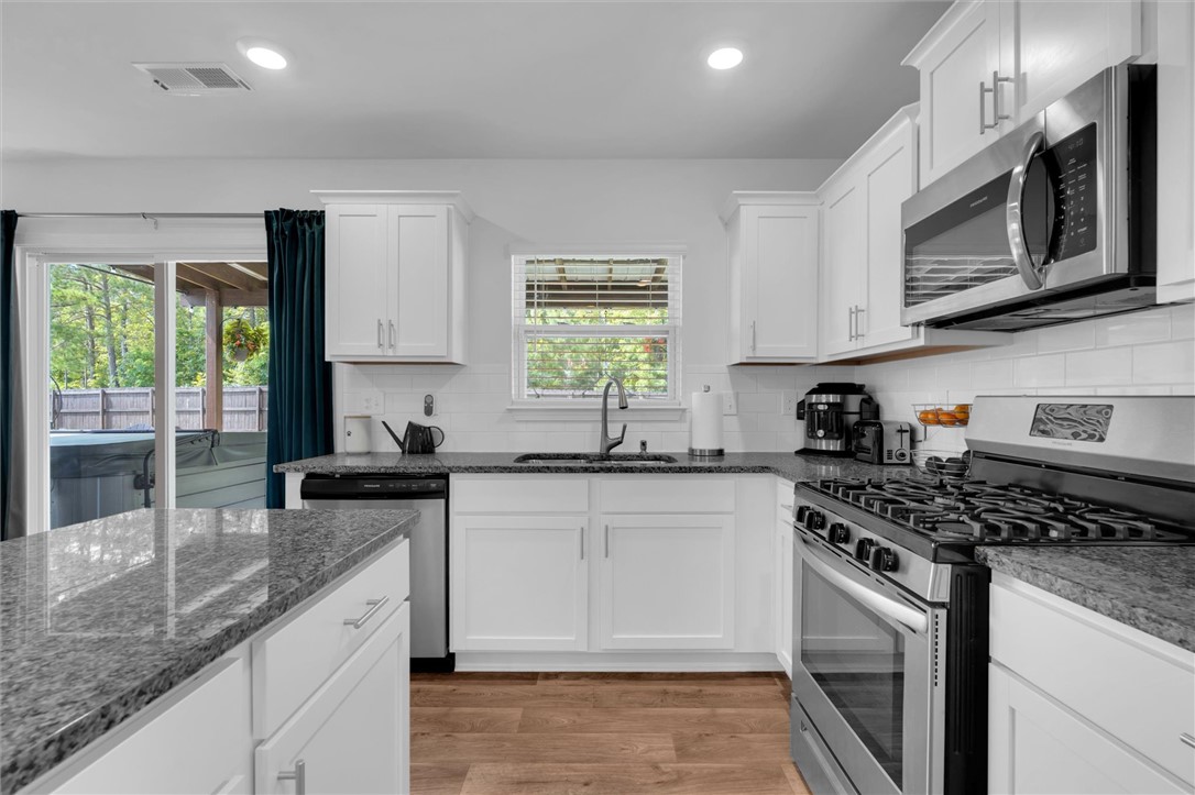 34 Karkinnen Court Pendleton, SC 29670 - Photo 13 of 36 A well-appointed kitchen features ample counter space, bright cabinetry, and modern stainless steel appliances.
