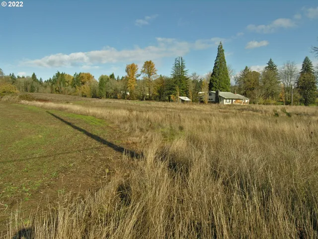 a view of a street with houses on both side
