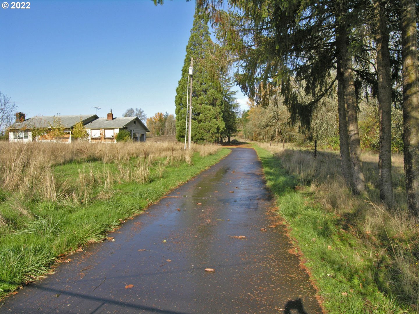 16075 Southwest Beef Bend Road Sherwood, OR 97140 - Photo 2 of 8 a view of a street with houses on both side