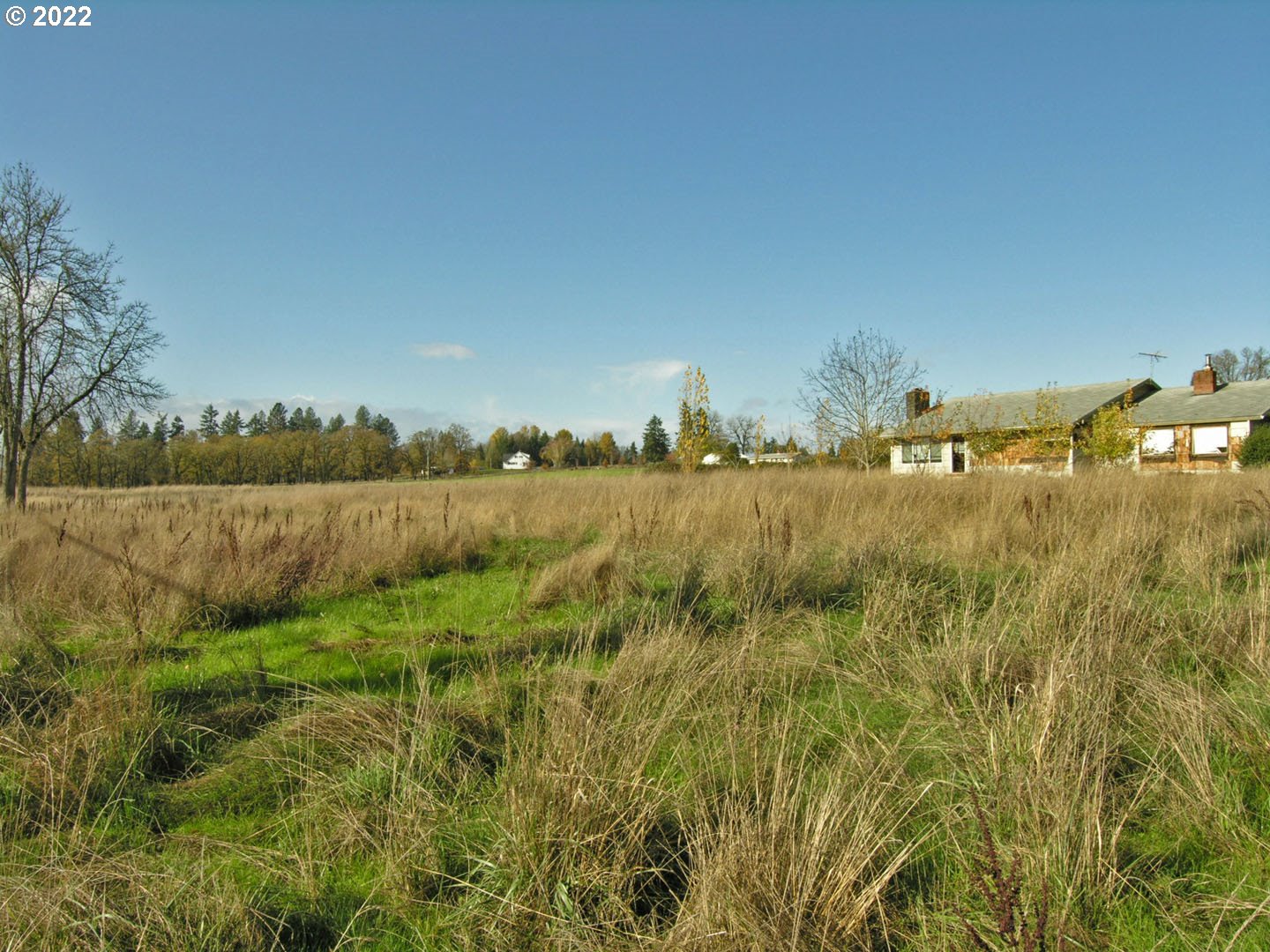16075 Southwest Beef Bend Road Sherwood, OR 97140 - Photo 3 of 8 a view of a lake with houses in the back