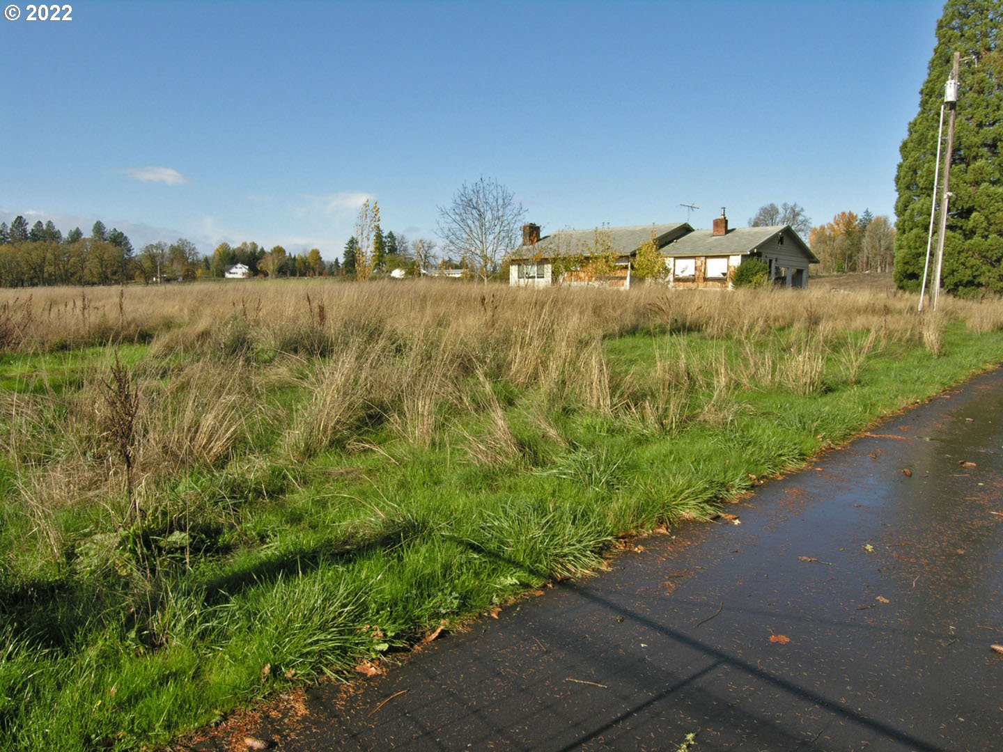 16075 Southwest Beef Bend Road Sherwood, OR 97140 - Photo 4 of 8 a view of a lake with houses in the back