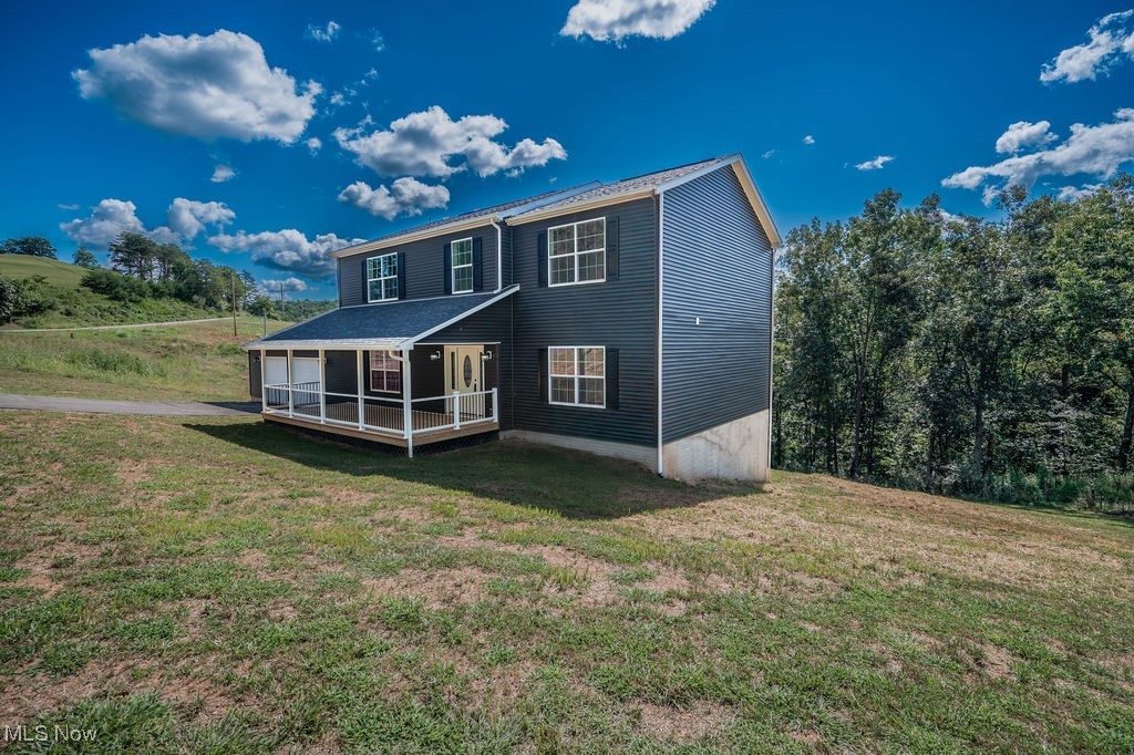 7343 Lost Pavement Road Belleville, WV 26133 - Photo 41 of 49 Back of property with a yard and a deck