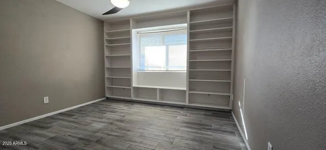 a view of an empty room with a closet