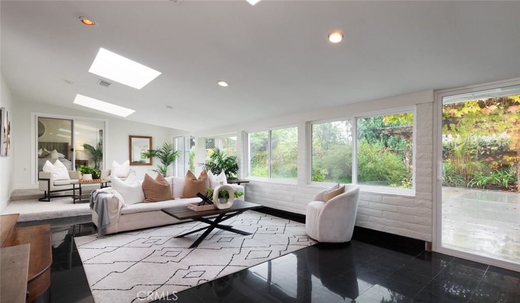 14191 Lambeth Way Tustin, CA 92780 - Photo 14 of 34 a living room with furniture and a large window