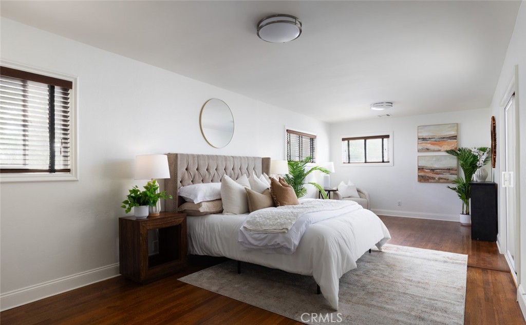 14191 Lambeth Way Tustin, CA 92780 - Photo 22 of 34 a bedroom with bed and wooden floor