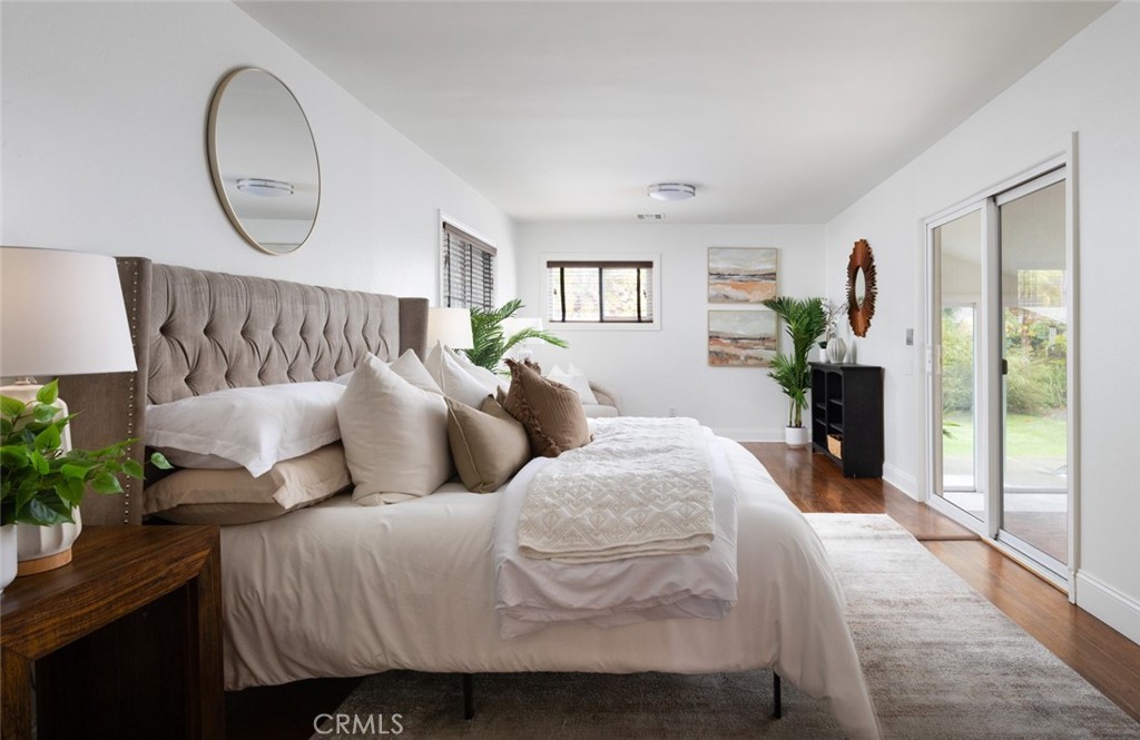 14191 Lambeth Way Tustin, CA 92780 - Photo 23 of 34 a bed room with a bed and a potted plant