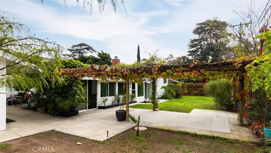 14191 Lambeth Way Tustin, CA 92780 - Photo 29 of 34 a wooden bench sitting in front of a building