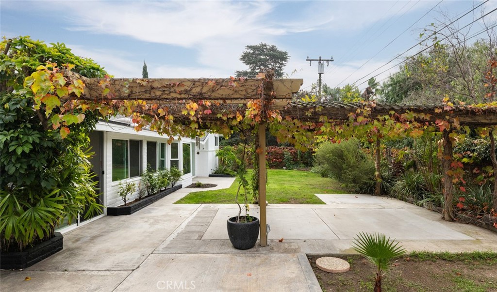 14191 Lambeth Way Tustin, CA 92780 - Photo 30 of 34 a view of a house with backyard and garden
