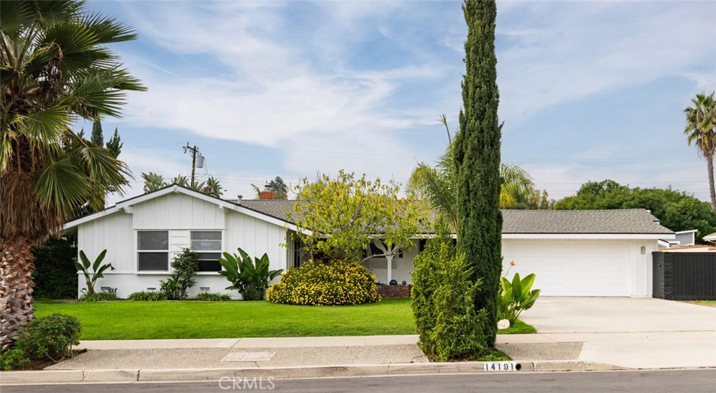 14191 Lambeth Way Tustin, CA 92780 - Photo 3 of 34 a view of front a house with a yard and potted plants