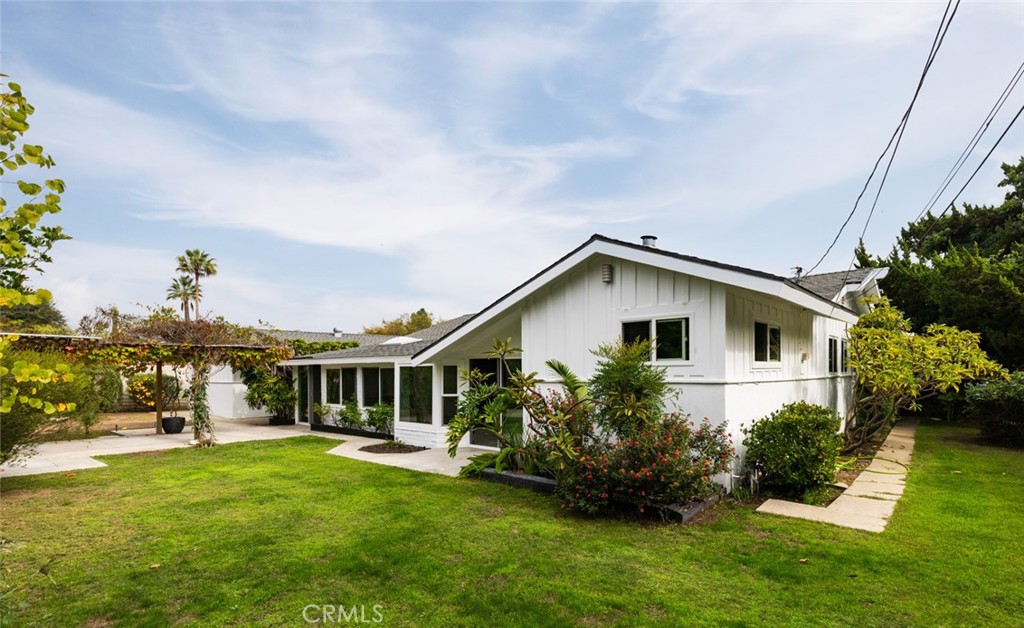 14191 Lambeth Way Tustin, CA 92780 - Photo 32 of 34 a view of an house with backyard space and garden