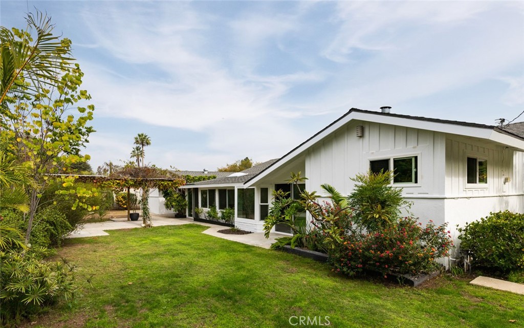 14191 Lambeth Way Tustin, CA 92780 - Photo 33 of 34 a view of a house with a yard and potted plants