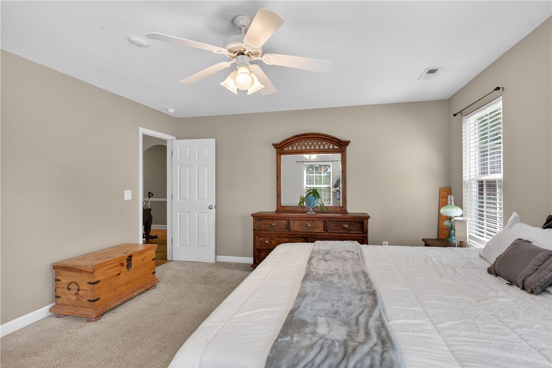 151 Towne Creek Trail Anderson, SC 29621 - Photo 17 of 49 Naturally illuminated bedroom with soft carpeting and a classic wood dresser.