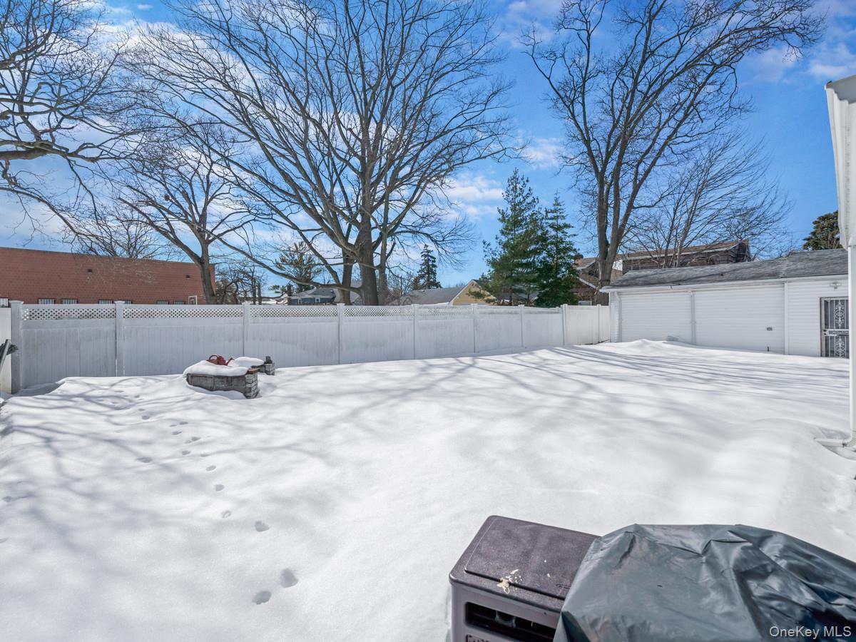 27-21 Coldspring Road Queens, NY 11691 - Photo 21 of 27 a view of a backyard of snow