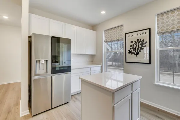 a kitchen with stainless steel appliances a refrigerator and a sink