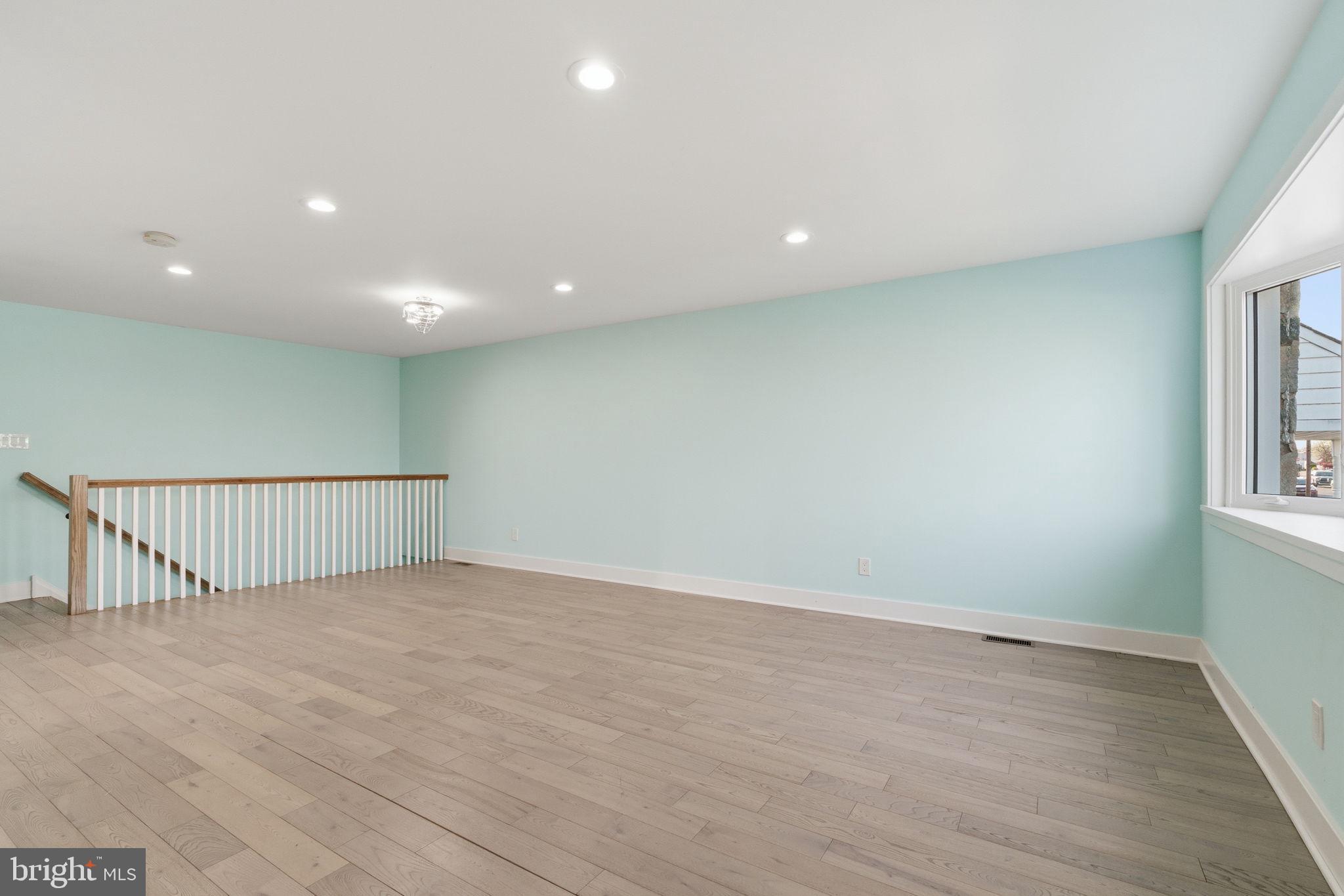 1944 Morrell Street Philadelphia, PA 19115 - Photo 12 of 44 a view of an empty room with wooden floor and a window