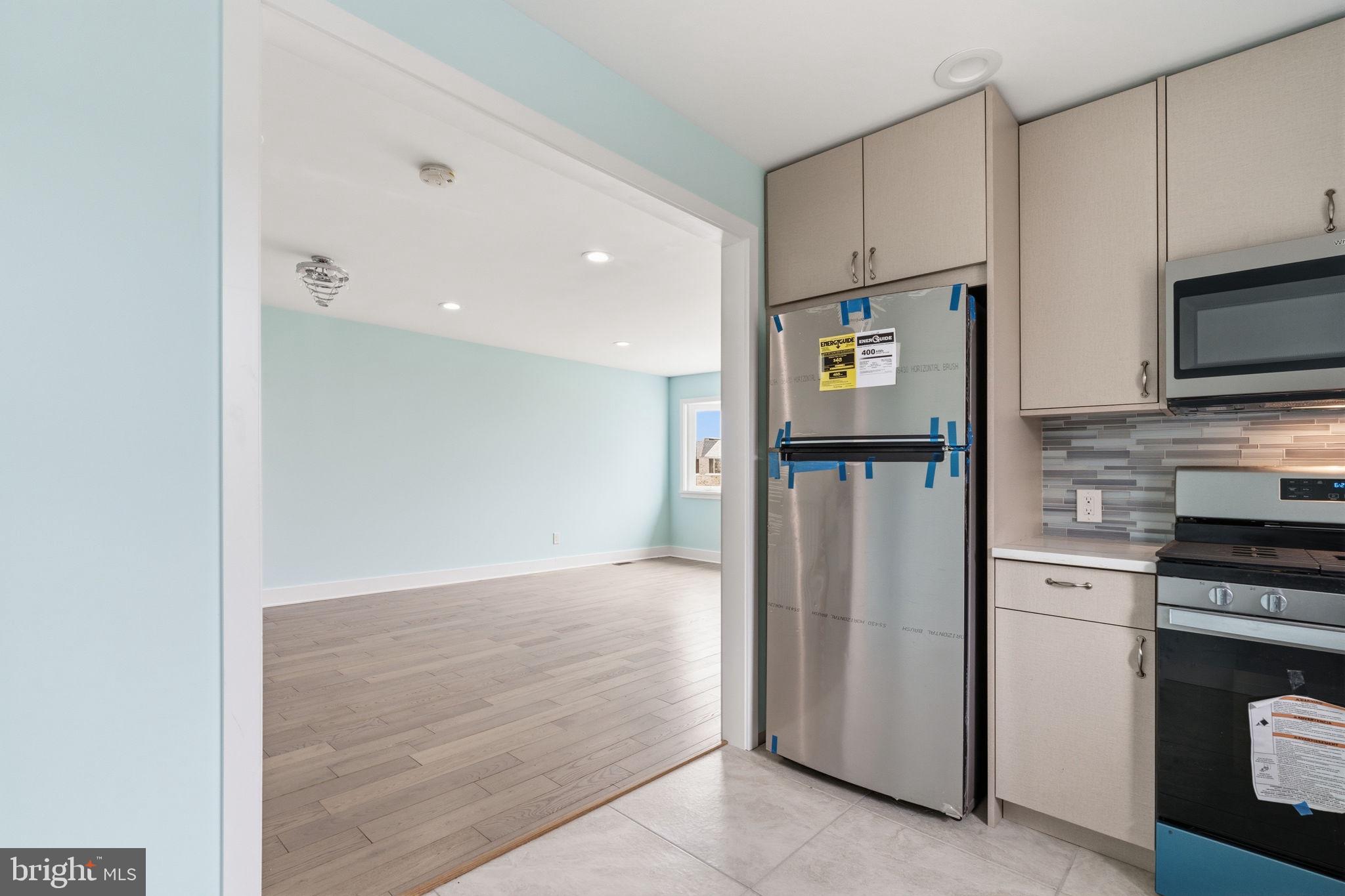 1944 Morrell Street Philadelphia, PA 19115 - Photo 14 of 44 a kitchen with stainless steel appliances granite countertop a refrigerator and a stove