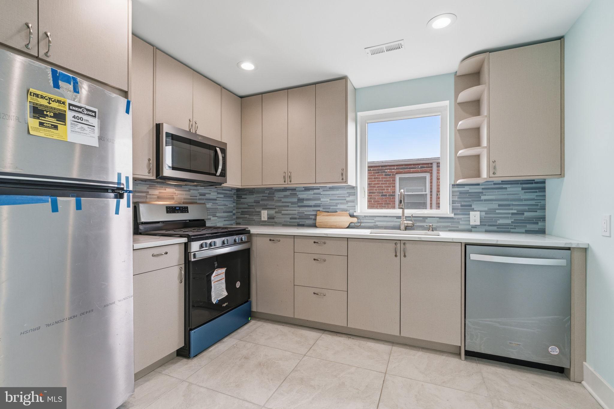 1944 Morrell Street Philadelphia, PA 19115 - Photo 15 of 44 a kitchen with granite countertop cabinets stainless steel appliances and a counter space