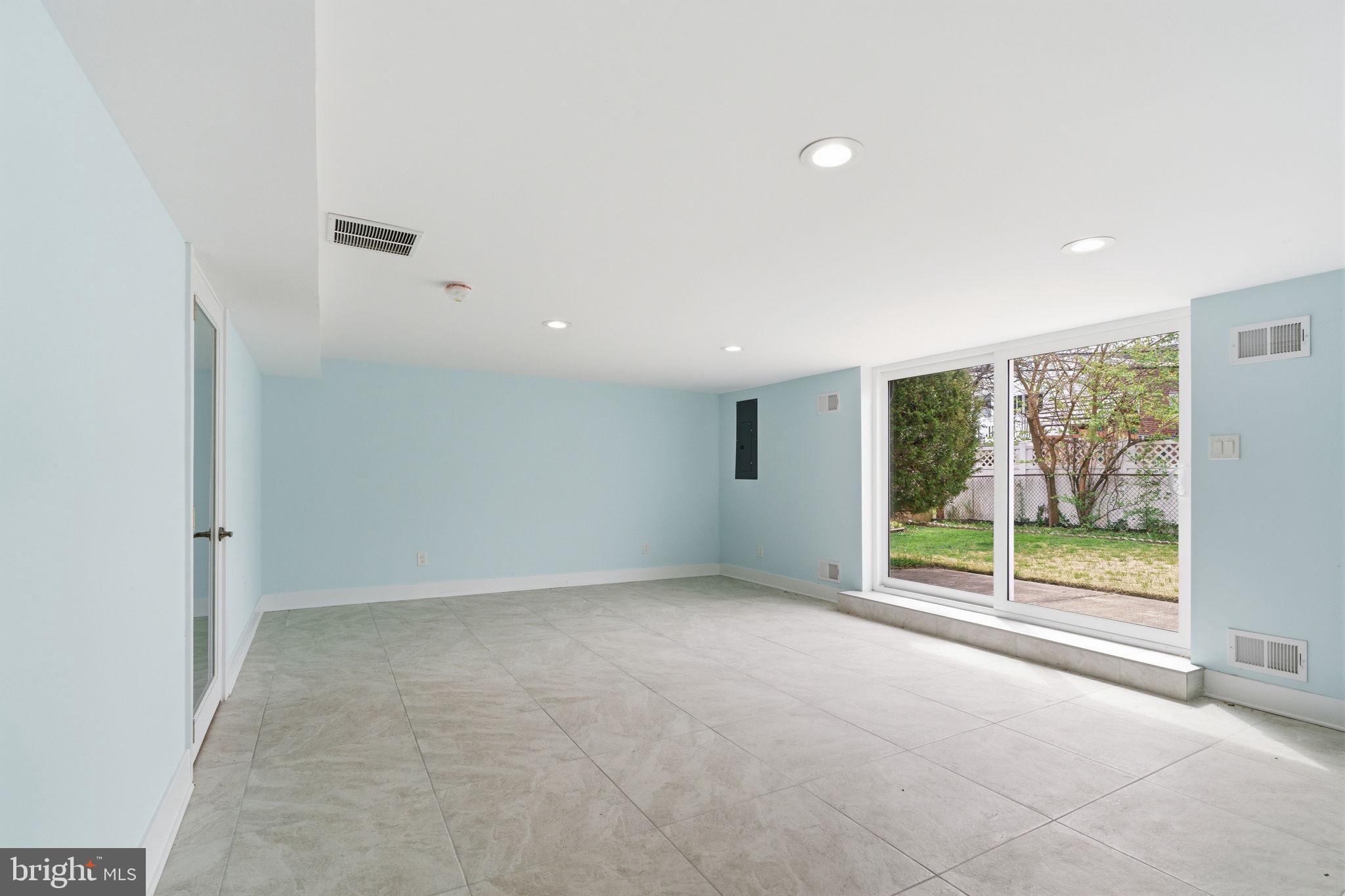 1944 Morrell Street Philadelphia, PA 19115 - Photo 32 of 44 en empty room with sliding glass door and glass door