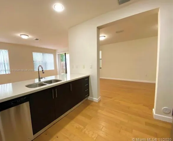 a kitchen with a sink and cabinets