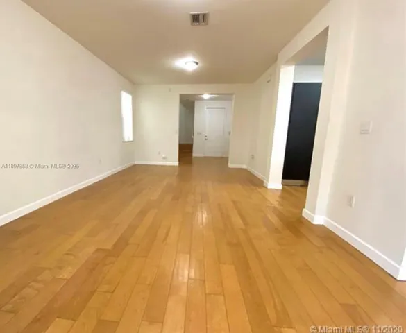 a view of an empty room and window