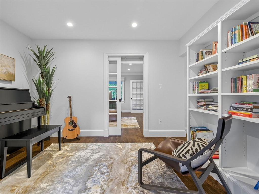 19 Marvin Road Wellesley, MA 02482 - Photo 13 of 33 a living room with furniture a bookshelf and a window