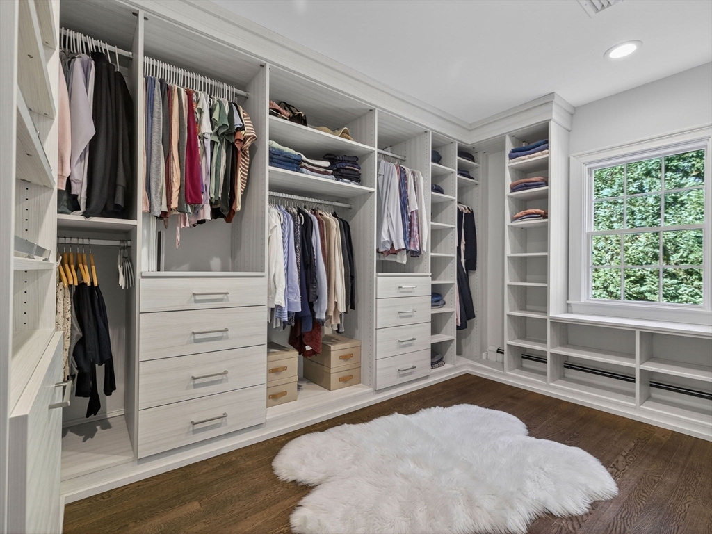 19 Marvin Road Wellesley, MA 02482 - Photo 19 of 33 a view of walk in closet with clothes and shoes