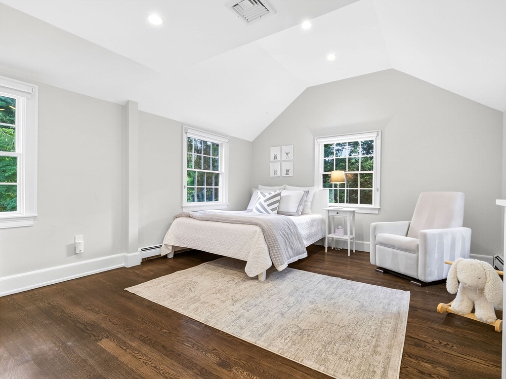 19 Marvin Road Wellesley, MA 02482 - Photo 22 of 33 a bedroom with a bed wooden floor and windows