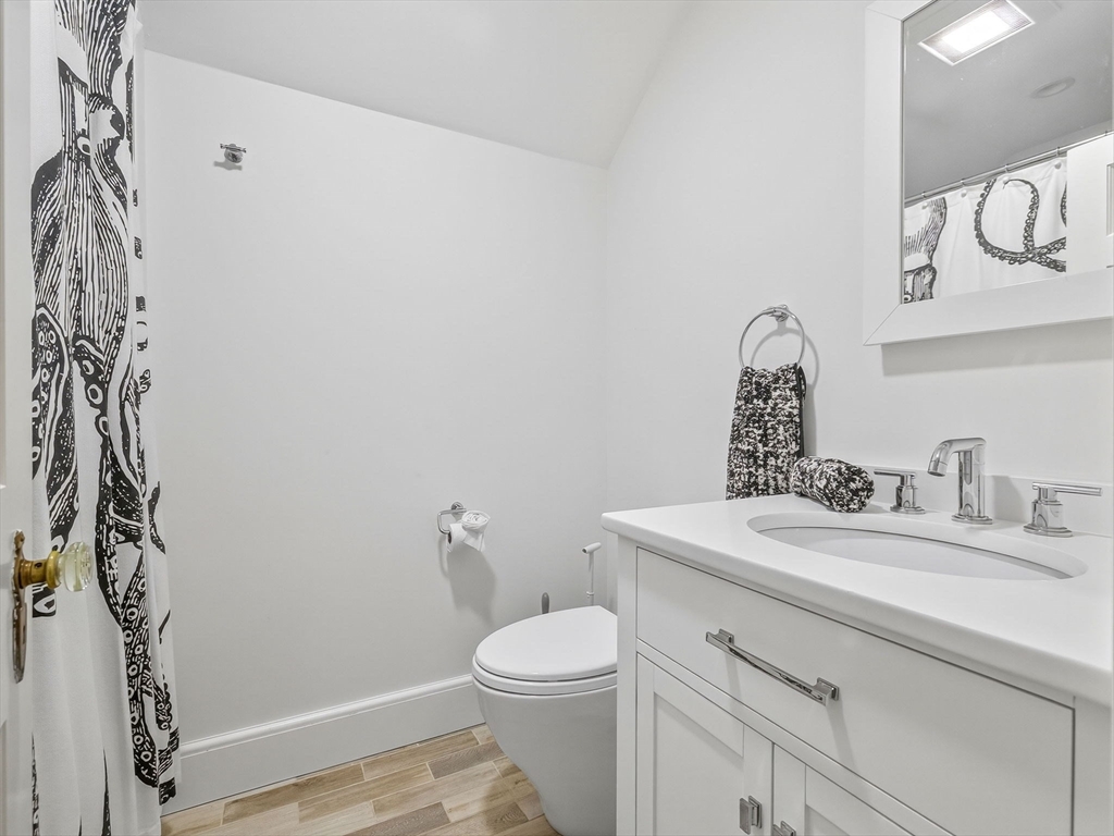 19 Marvin Road Wellesley, MA 02482 - Photo 23 of 33 a bathroom with a sink a toilet and vanity