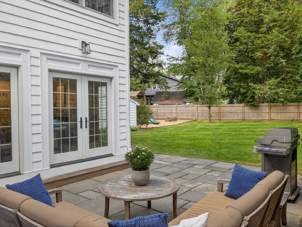 19 Marvin Road Wellesley, MA 02482 - Photo 30 of 33 a view of a house with backyard sitting area and garden