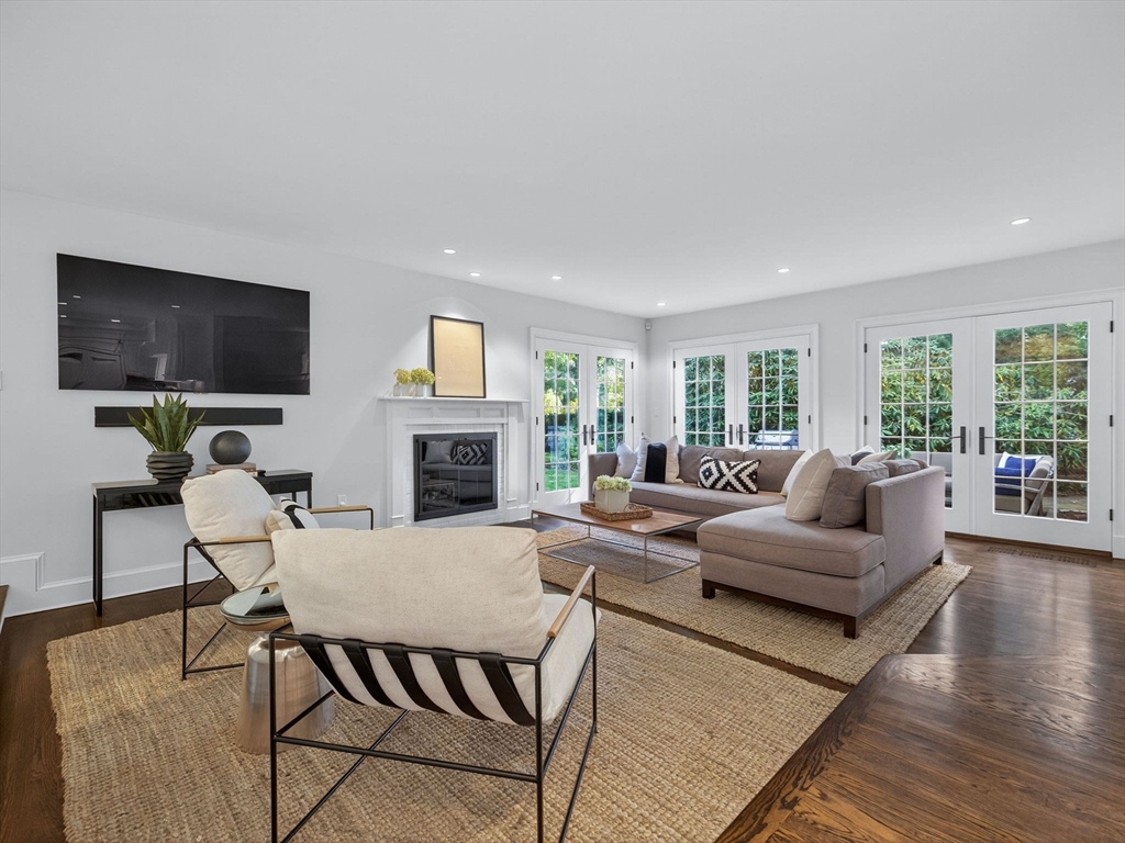 19 Marvin Road Wellesley, MA 02482 - Photo 10 of 33 a living room with furniture a flat screen tv and a fireplace