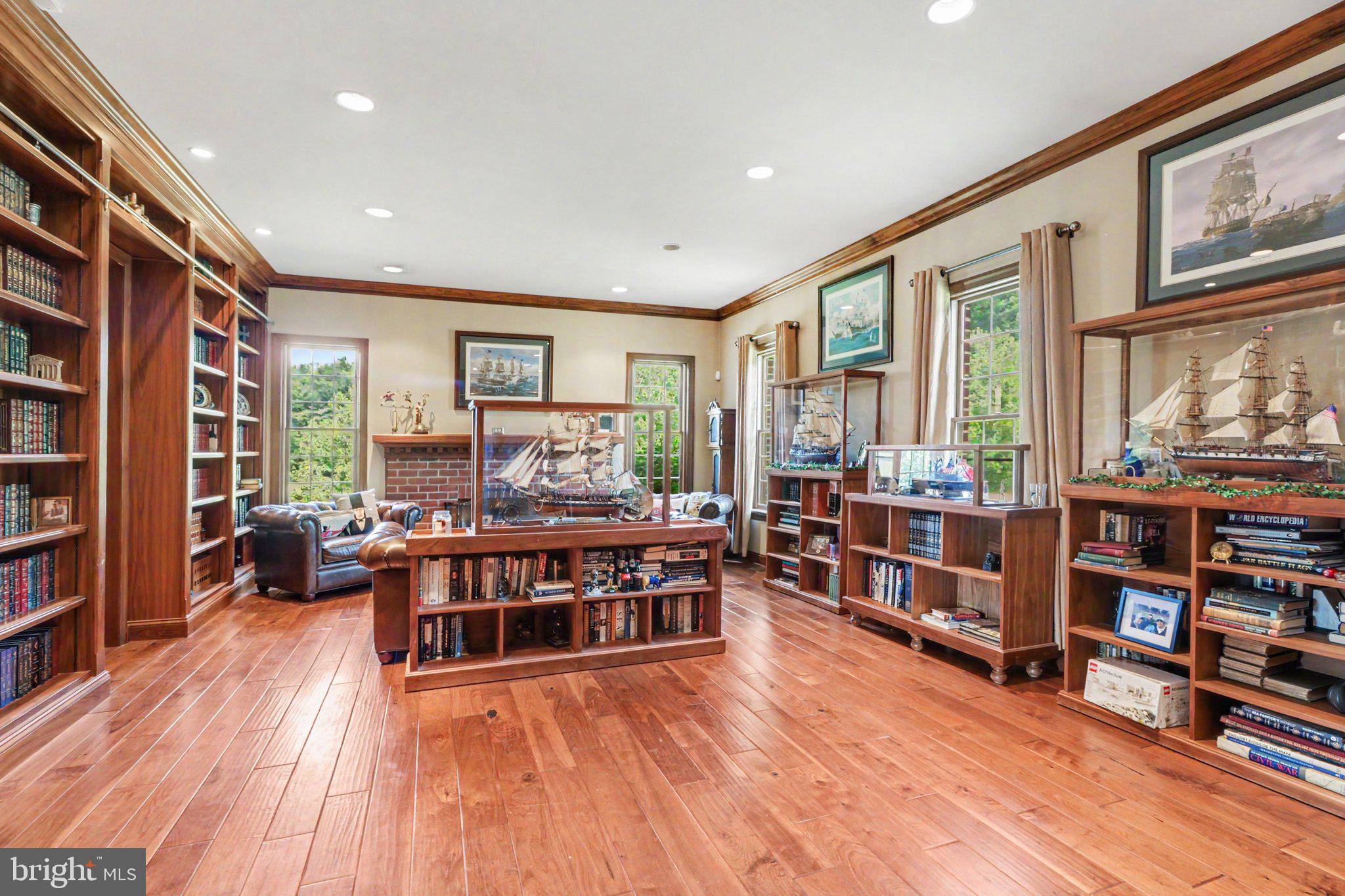 1080 Swatara Road Hershey, PA 17033 - Photo 12 of 59 a living room with furniture a flat screen tv and a book shelf