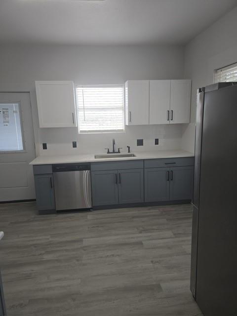 608 East Pecan Street Taylor, TX 76574 - Photo 11 of 25 a large kitchen with window and cabinets