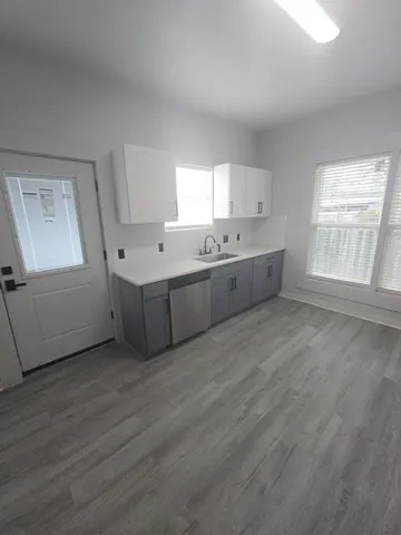 a large white room with windows