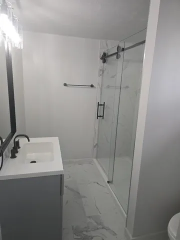 a bathroom with a sink and toilet