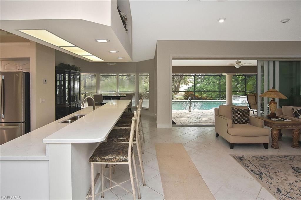 8928 Lely Island Circle Naples, FL 34113 - Photo 13 of 44 a very nice looking living room with a large window