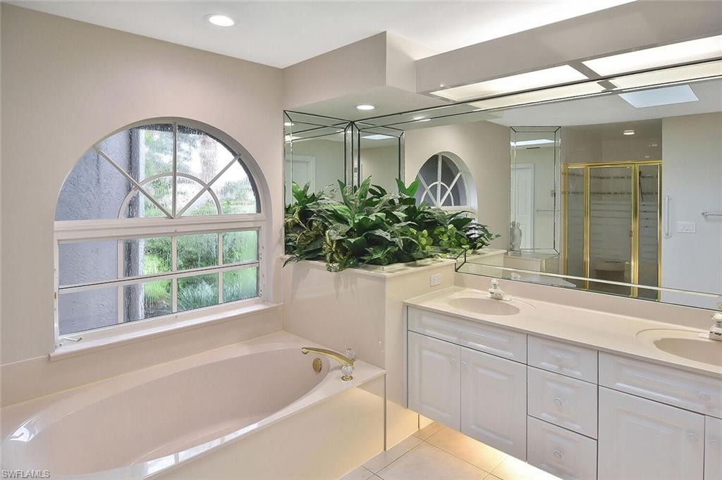 8928 Lely Island Circle Naples, FL 34113 - Photo 26 of 44 a bathroom with a sink and a bathtub
