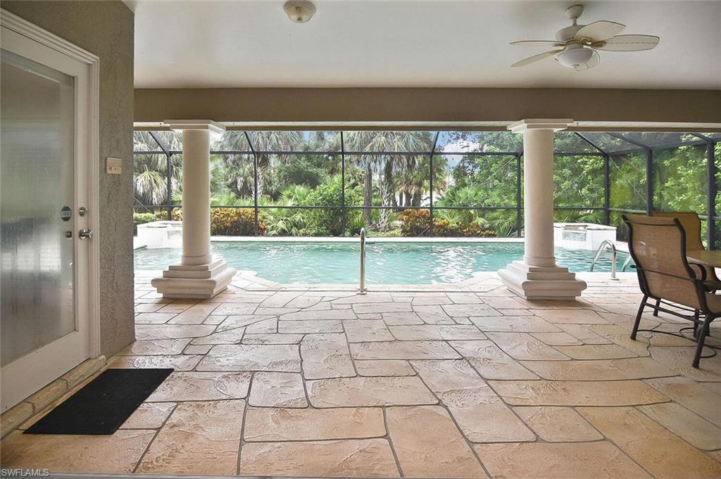 8928 Lely Island Circle Naples, FL 34113 - Photo 29 of 44 a view of empty room with wooden floor and fan