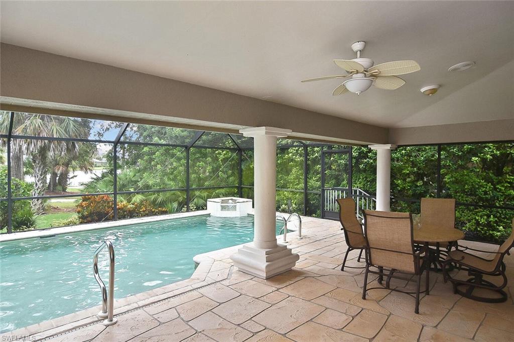 8928 Lely Island Circle Naples, FL 34113 - Photo 30 of 44 a living room with furniture and a large window