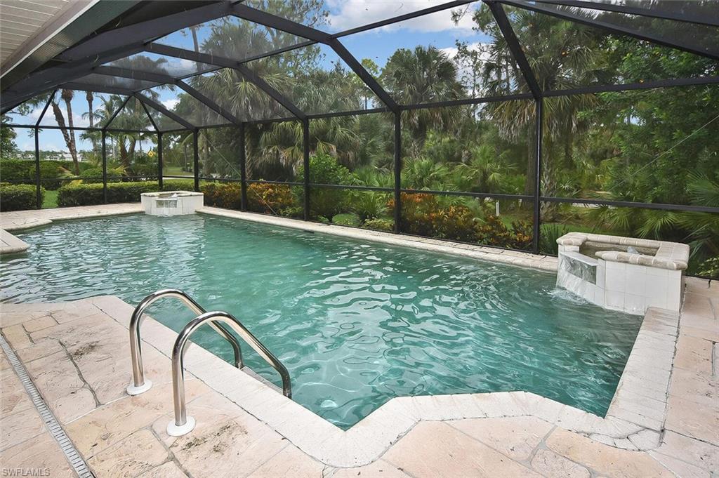 8928 Lely Island Circle Naples, FL 34113 - Photo 33 of 44 a view of a swimming pool with a patio