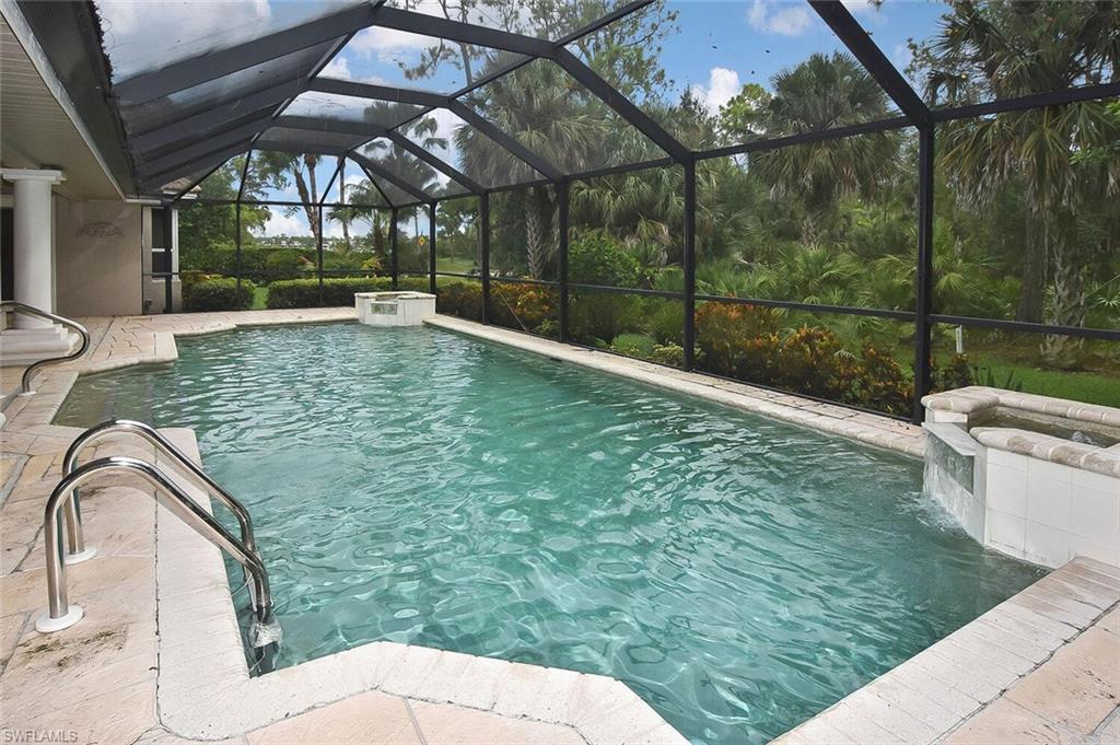 8928 Lely Island Circle Naples, FL 34113 - Photo 39 of 44 a view of a swimming pool with a patio