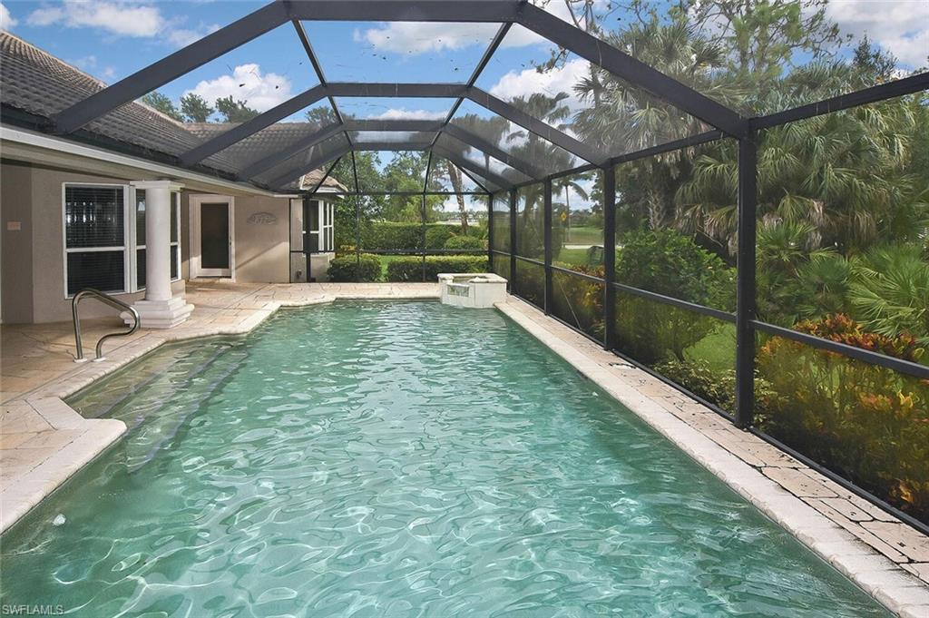 8928 Lely Island Circle Naples, FL 34113 - Photo 40 of 44 a view of a swimming pool with a porch