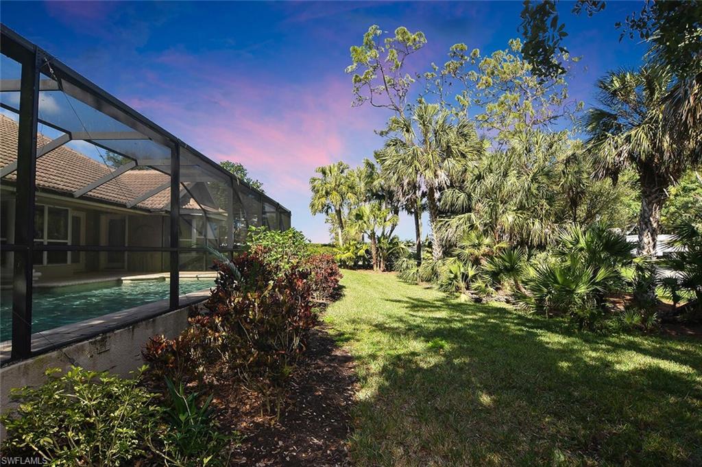 8928 Lely Island Circle Naples, FL 34113 - Photo 44 of 44 a view of flower garden with a small yard