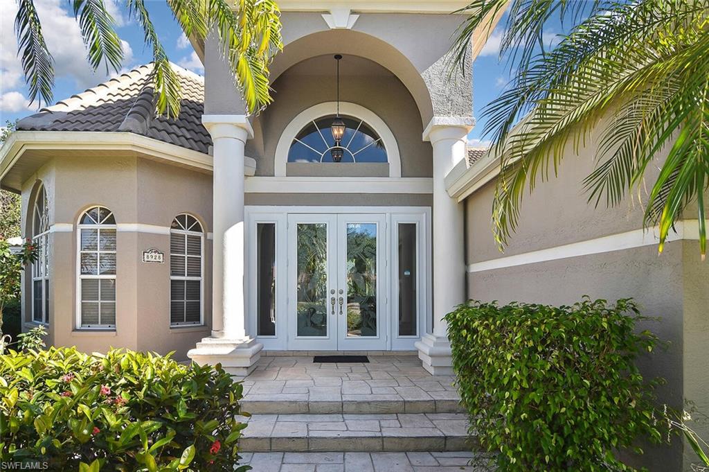 8928 Lely Island Circle Naples, FL 34113 - Photo 5 of 44 a house view with a outdoor space
