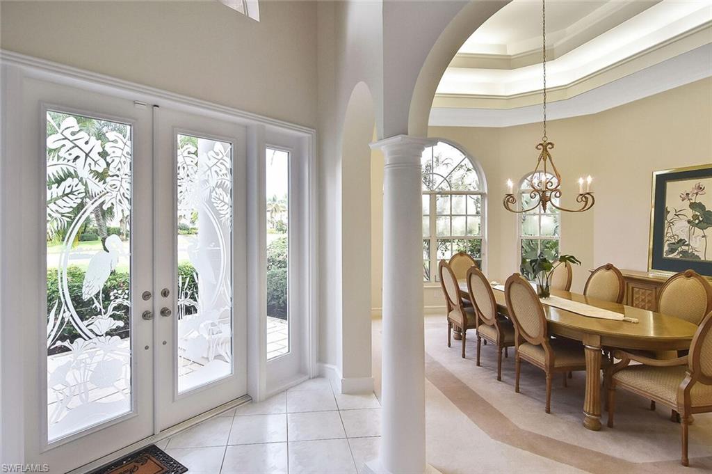 8928 Lely Island Circle Naples, FL 34113 - Photo 6 of 44 a view of a dining room with furniture window and outside view