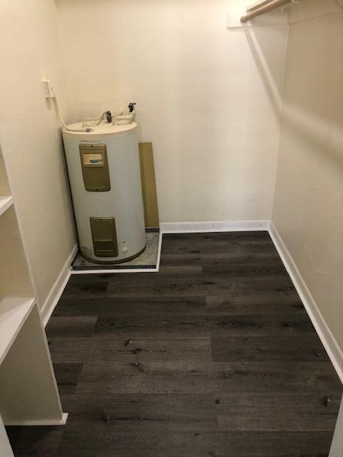 299 Southwest 7th Street, Unit 103 Boca Raton, FL 33432 - Photo 15 of 24 a utility room with wooden floor washer and dryer