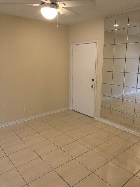299 Southwest 7th Street, Unit 103 Boca Raton, FL 33432 - Photo 5 of 24 Living Room to front Door