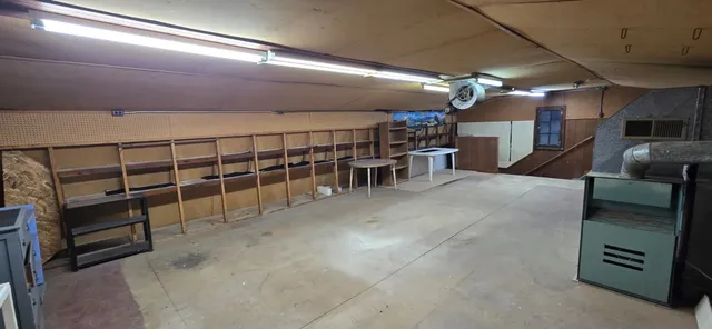 a view of a hallway with seating area