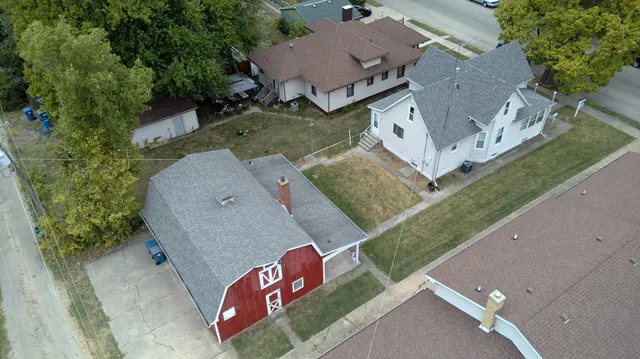 an aerial view of a house with outdoor space